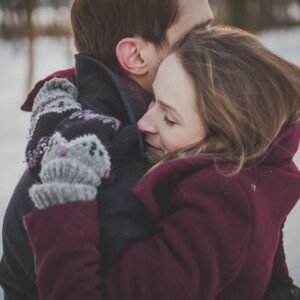 A couple hugging passionately.